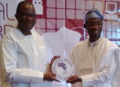 L-r: Wale Ajisebutu, vice chairman, 21st Century being inducted into the ADA Hall fame by Governor Rauf Aregbesola of Osun State